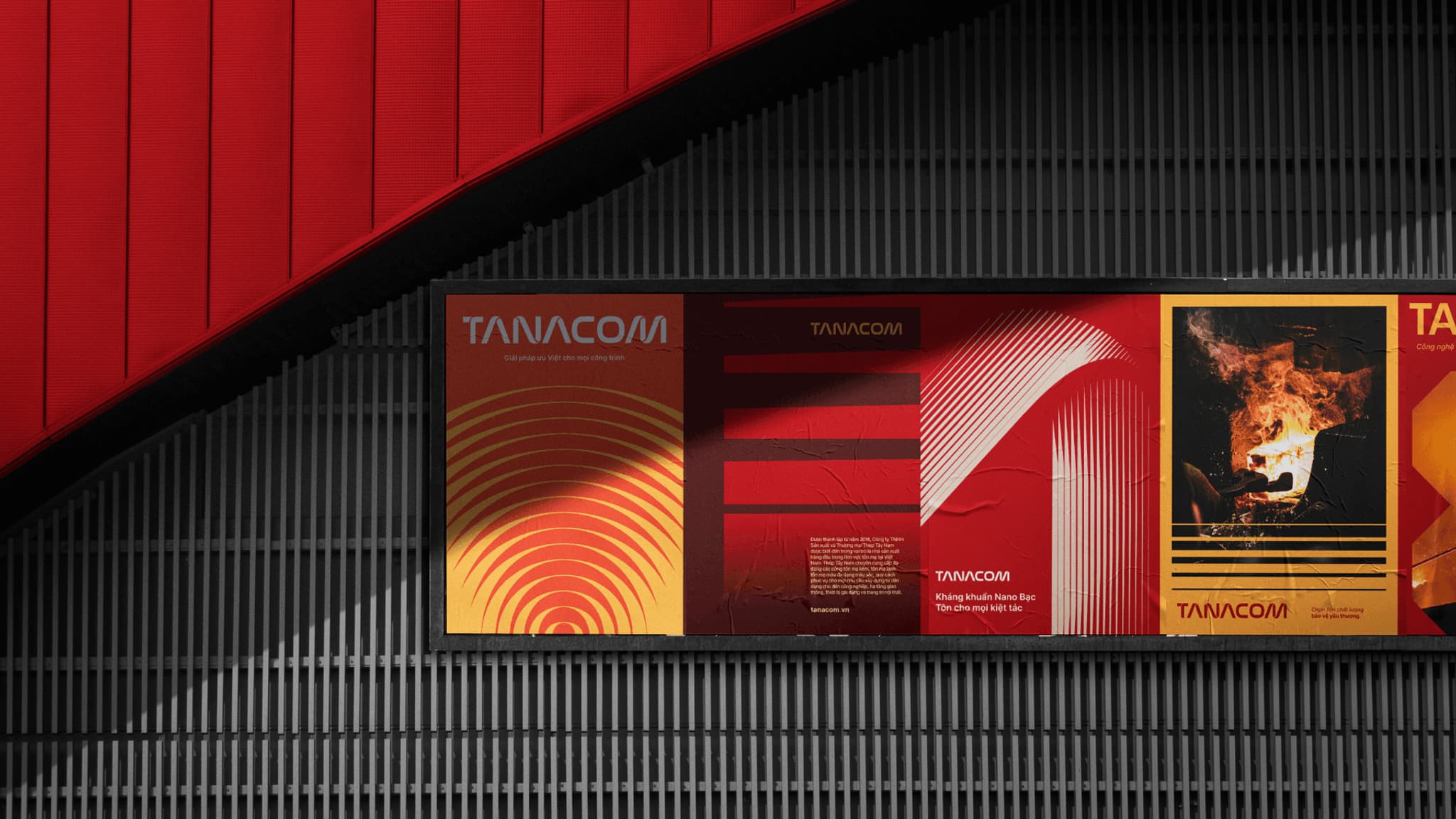 Red and orange Tanacom branding on a wall display, featuring modern graphic designs and textures.
