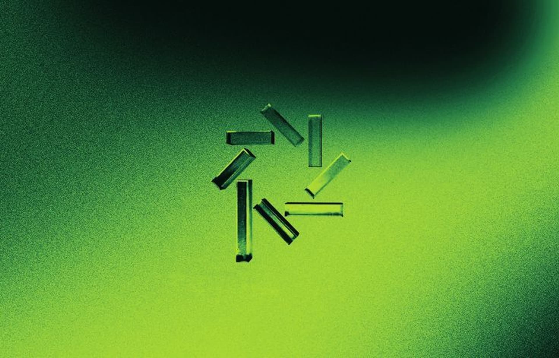 Abstract design featuring geometric green shapes on a dark gradient background, creating a modern and vibrant visual.