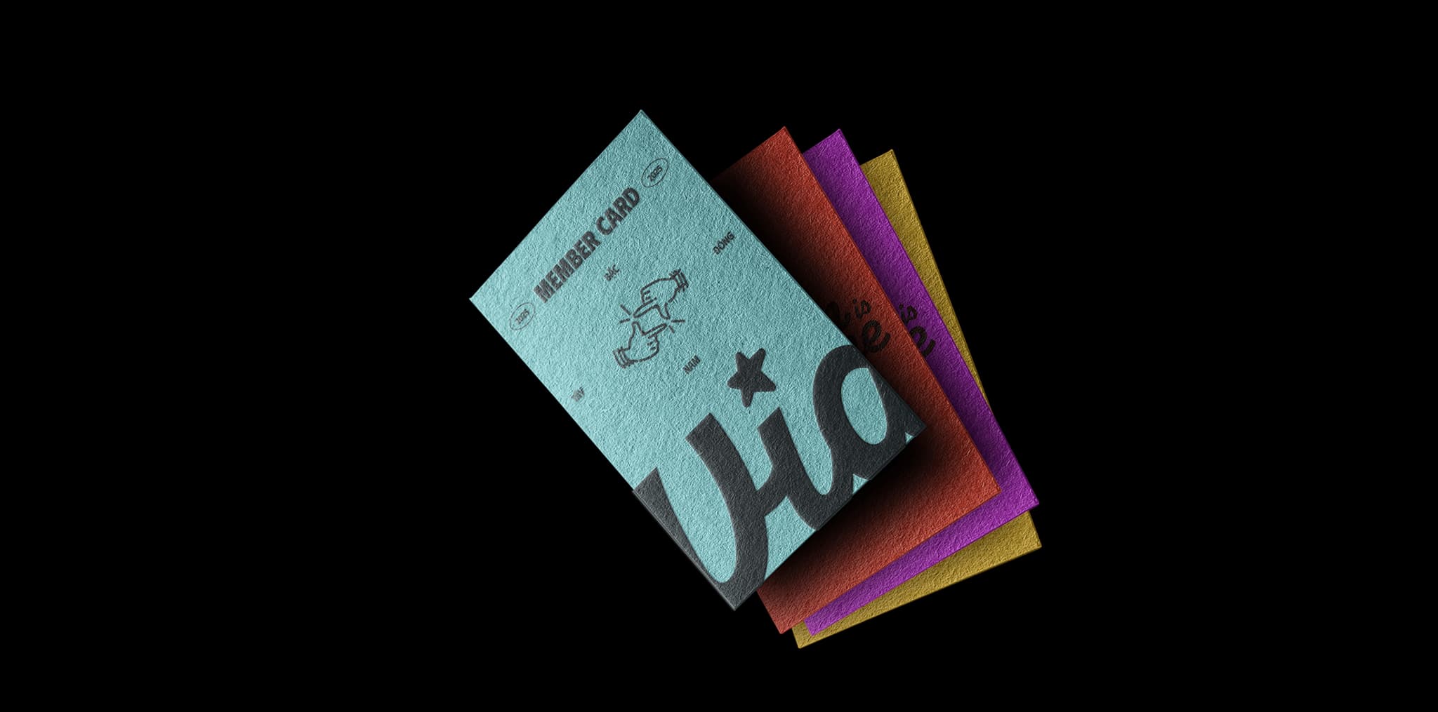 Colorful business cards stacked together, featuring playful designs and illustrations on a black background.