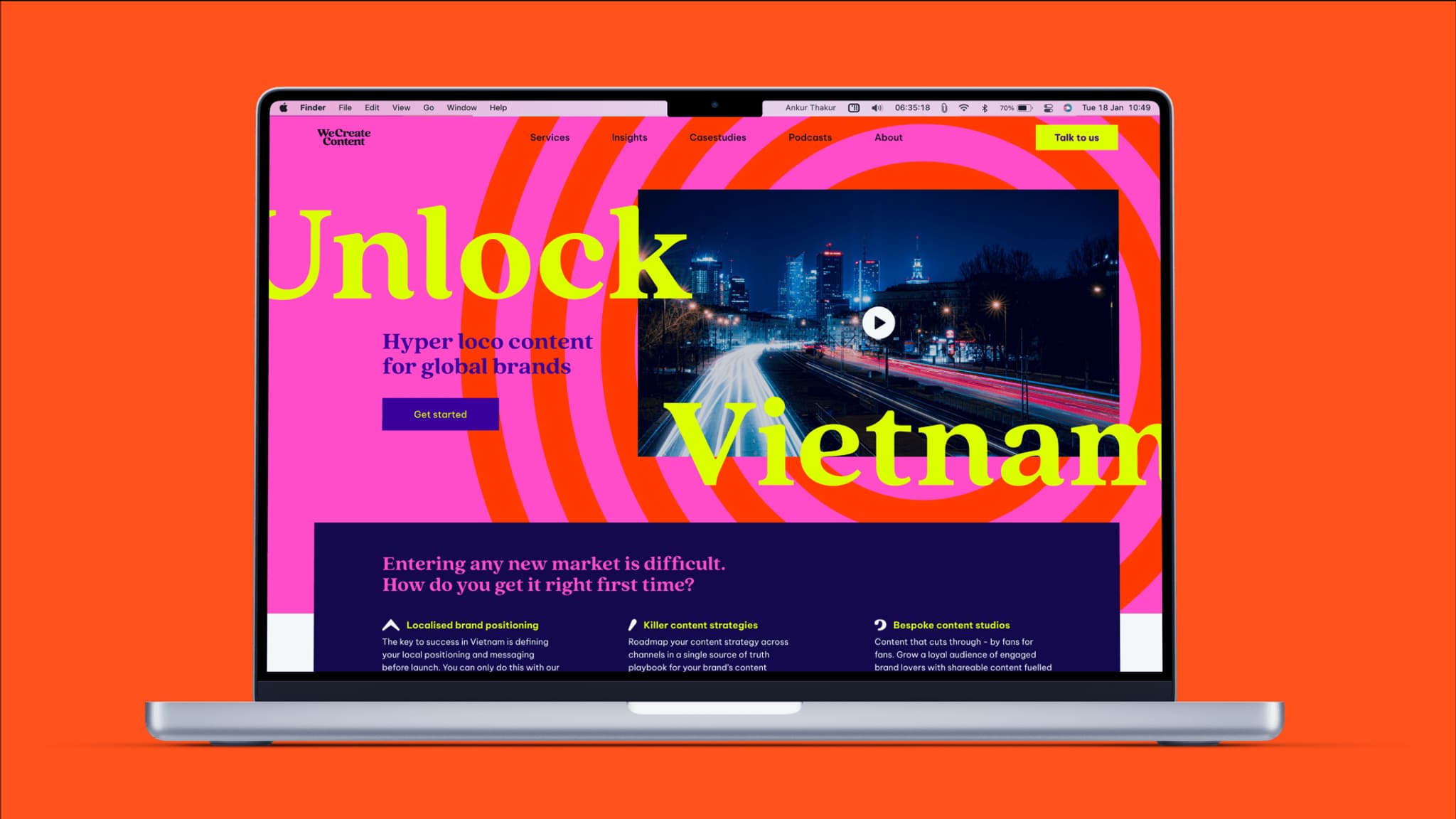 Colorful laptop display showcasing a website titled "Unlock Vietnam," emphasizing global branding and market entry strategies.